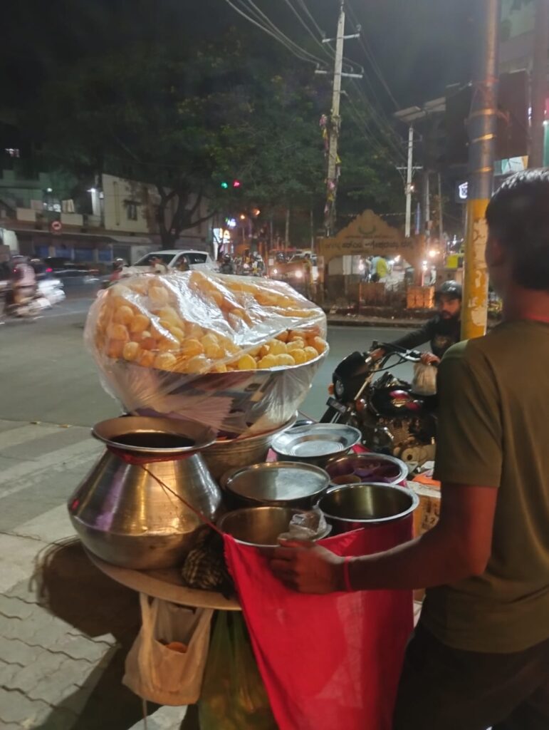 Yellow baked goods on stand near metal bowls